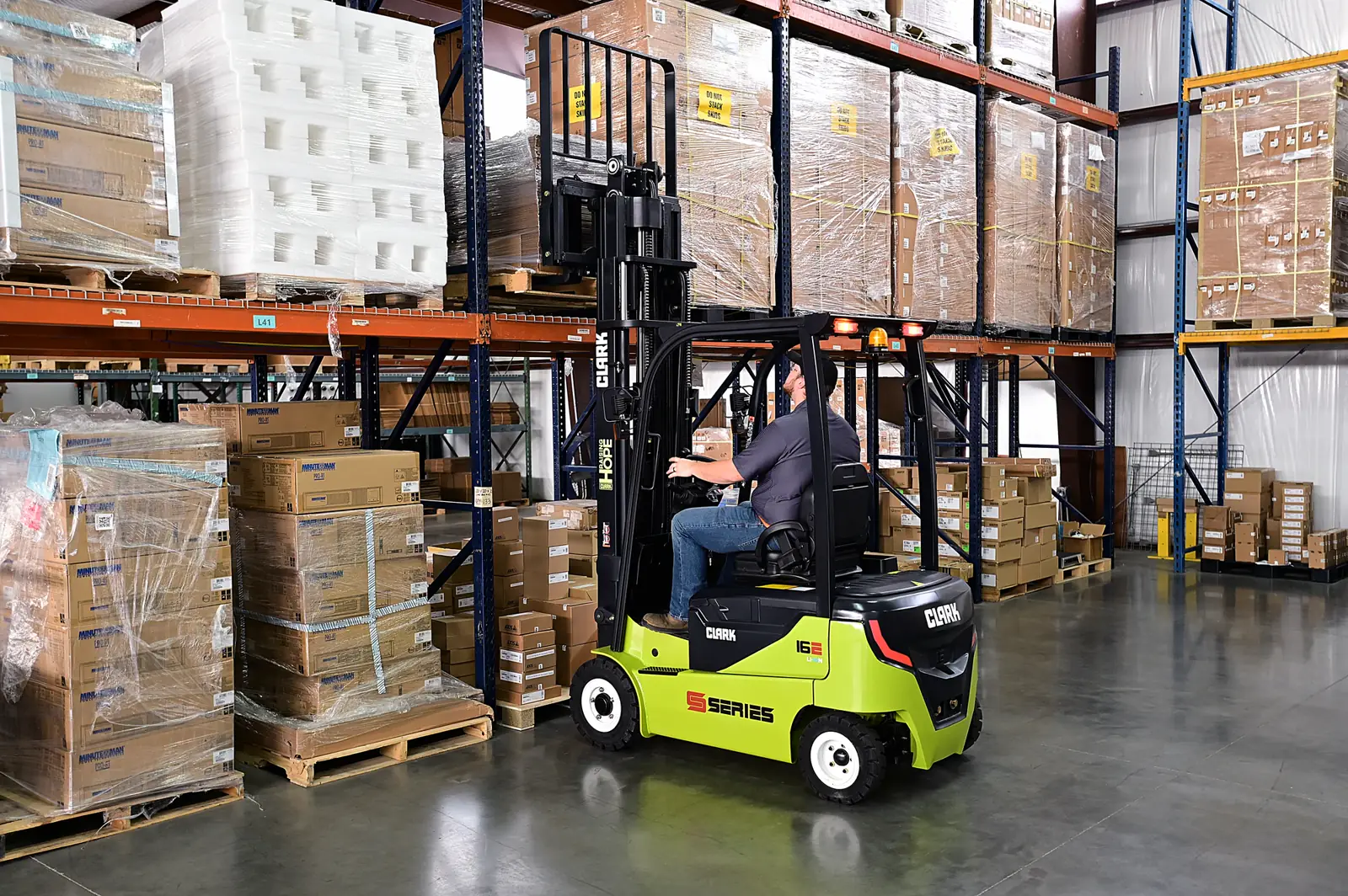 Forklift working in front of pallet racking at a warehouse in Chesterfield County, VA